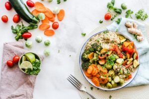 Mediterranean diet foods including salmon, vegetables, and olive oil for rheumatoid arthritis management